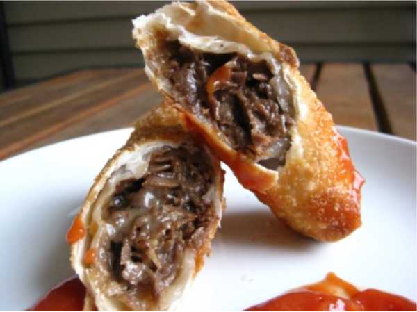 Traditionally cooked Philadelphia cheese steak meat and American cheese rolled in a spring roll wrapper and fried. Served with a sweet-hot chipotle dip and ketchup.
