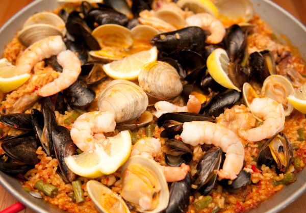 A classic Mediterranean rice dish (mildly spicy), made with clams, shrimp, scallops, chicken & saffron.