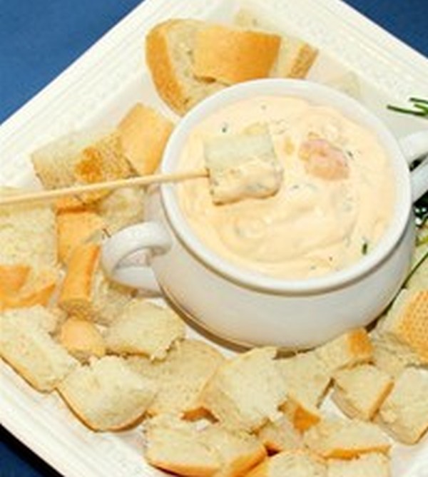 A spicy blend of Colby cheese and jalapeno peppers served with crusty bread cubes for dipping.