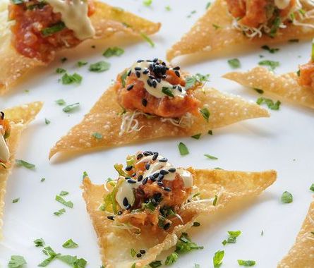 #1 Ahi Tuna tartar mixed with spicy mayo, served in freshly made fried won ton cups and topped with diced scallions.