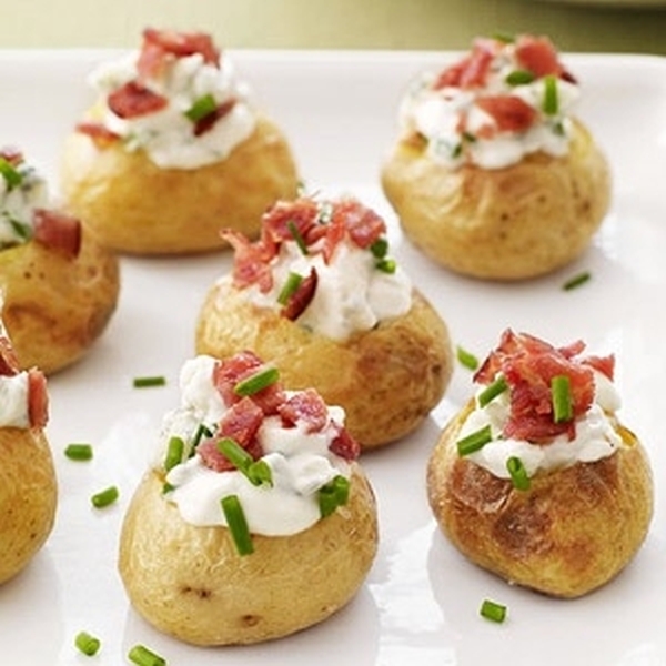 Roasted baby red bliss potatoes stuffed with cheese, bacon & sour cream and baked.