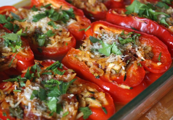 Bell peppers stuffed with beef, Italian sausage & rice with tomato sauce