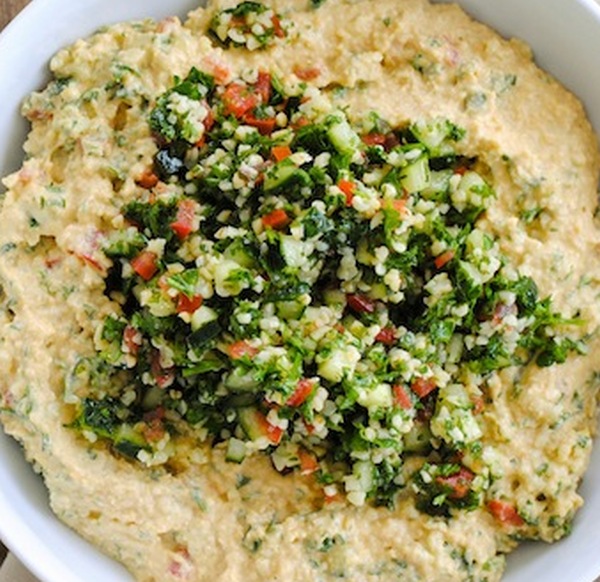 Traditional cracked wheat salad served with chickpea hummus and curried pita chips.