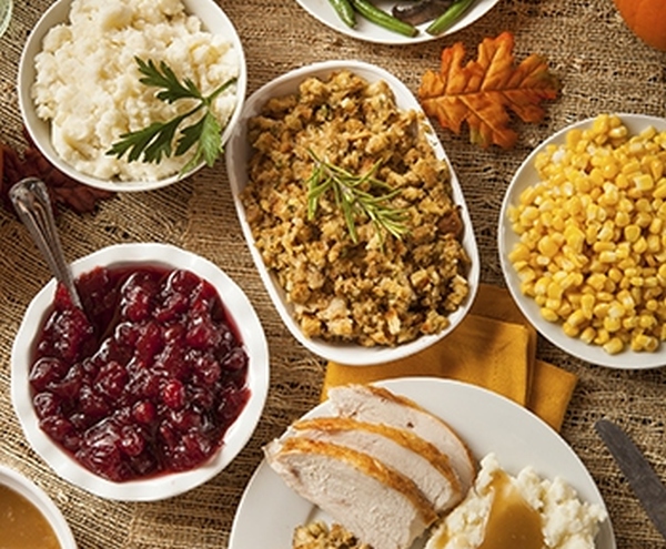 Traditional thanksgiving dinner with all the fixins! Our roasted turkey, stuffing, corn, gravy & homemade cranberry sauce.